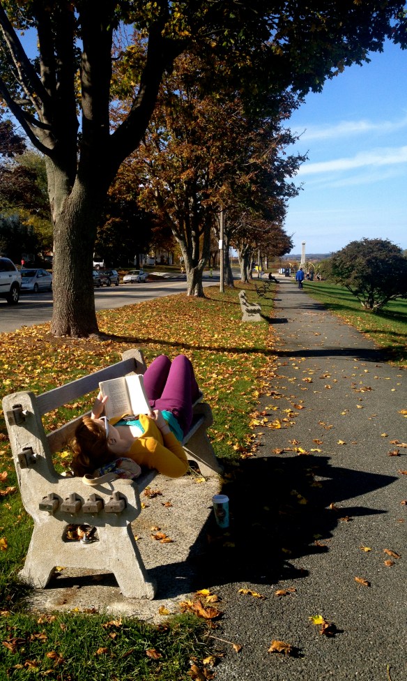 A Portlander reading by the waterfront