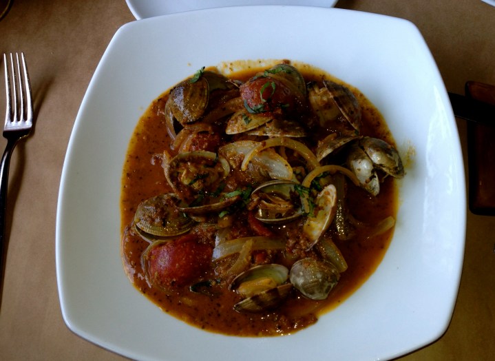 Portuguese clams at River's End. Manila clams steamed in white wine with house made chorizo, sauteed garlic, tomatoes, and the house herb butter