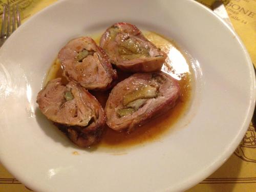 Lamb rolled and roasted with carciofi. 
